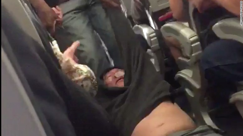 United Airlines passenger being removed from the flight